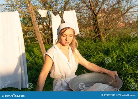 Young Woman Hanging Laundry Outdoors Beautiful Girl Working In