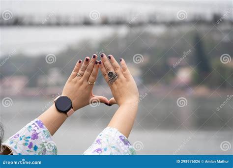 Hands Of Indian Woman With Purple Nail Polish And Ring Saying Musafir