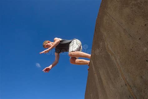 Boy Jumping Somersault Blue Parkour Stock Photo Image Of Hour Wall