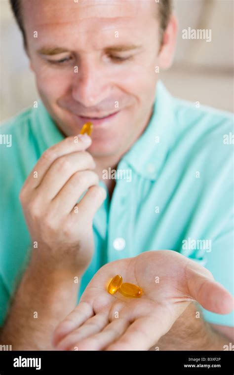 Man Taking Pills Stock Photo Alamy