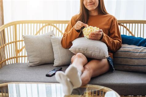 Premium Photo Close Up Image Of A Young Woman Holding And Eating Pop