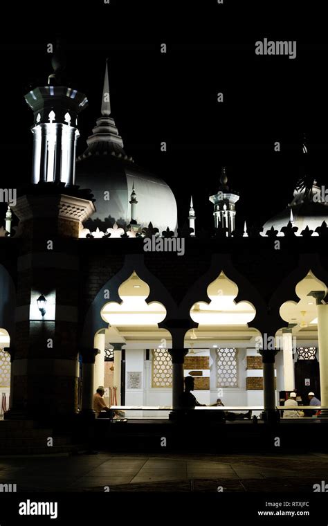 Men Reading Masjid Jamek Jamek Mosque At Night Kuala Lumpur