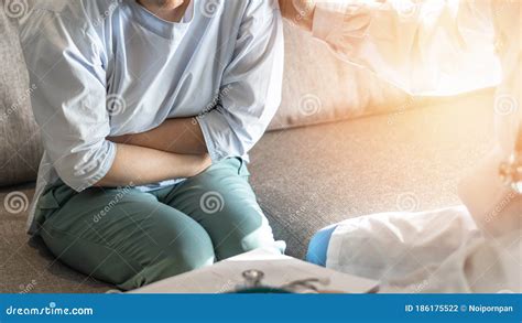 Abdominal Pain Patient Woman Having Medical Exam with Doctor on Illness from Stomach Cancer ...