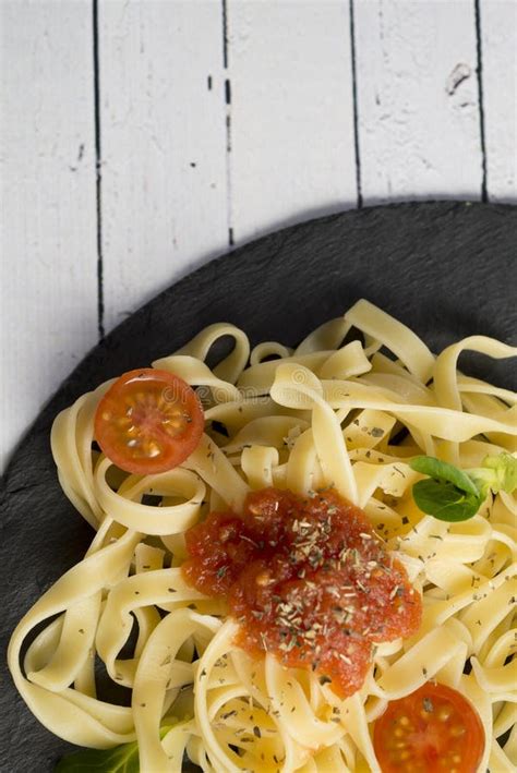 Homemade Fresh Pasta Spaghetti Dish With Tomato And Oregano Stock Image