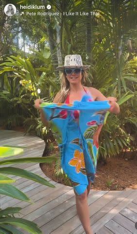 Heidi Klum Dances In A Plunging Red Hot Bikini And Zebra Print Bucket Hat