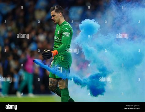 Manchester City Goalkeeper Ederson Clears A Flare Of The Pitch After Manchester City Third Goal