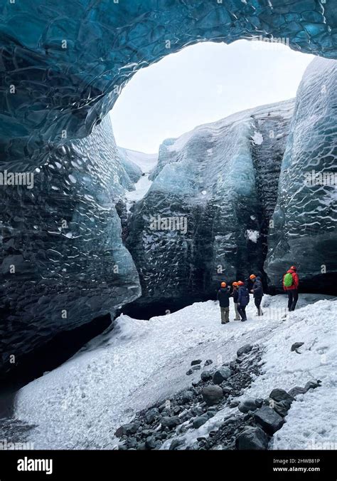 Tourists Inside A Glacier In Skaftafell National Park In Iceland The