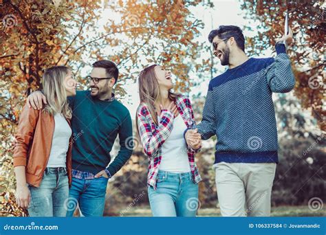 Young People Walking through Park Stock Photo - Image of friends, race ...