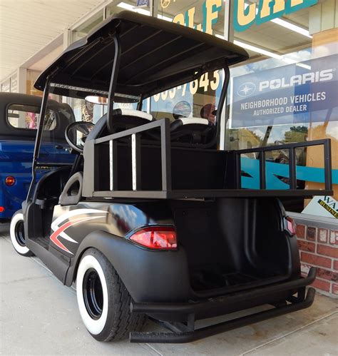 Low Rider Scull And Cross Bolt Club Car Golf Cart In Sun City Center Plaza