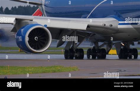 Undercarriage And Engine Of Jambo Jet Airplane Moving On Taxiway