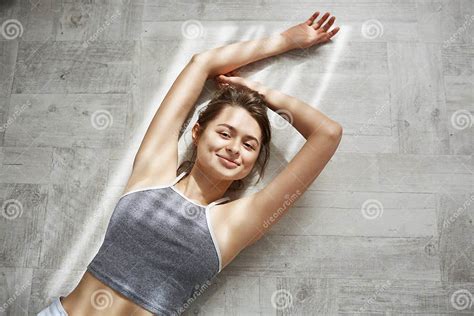 Portrait Of Young Tender Beautiful Girl Smiling Looking At Camera Lying