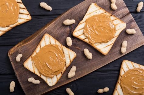 Premium Photo Peanut Butter Sandwiches Or Toasts On Wooden Background