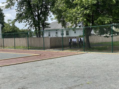 The Security Fence is Going Up — Edison Community Garden