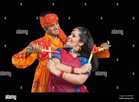 Holding Dandiya Hi Res Stock Photography And Images Alamy