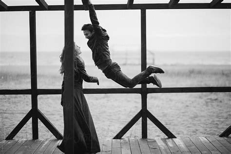 Couple On The Sea Shore Out Of Swimsuit Season By Stocksy Contributor