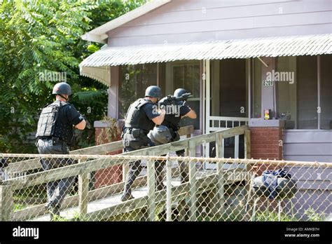 Police Officers From Tactical Narcotics Unit Carrying Out High Risk