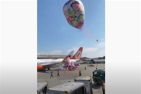 Vídeo balão gigante logo do SBT cai e atinge avião em Guarulhos