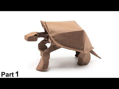 An Origami Tortoise Made Out Of Brown Paper