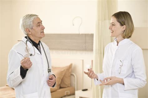 Medical Colleagues Talking About The Job Stock Image Image Of