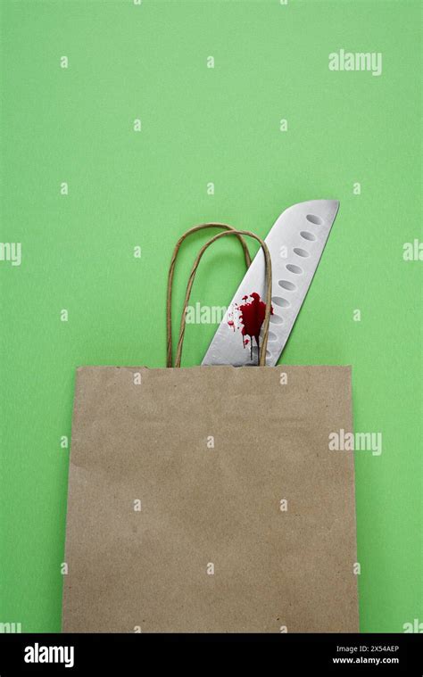 Bloody Kitchen Knife In A Brown Paper Bag Stock Photo Alamy