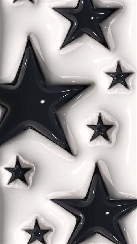 Black And White Stars Are Arranged In The Shape Of An Abstract Pattern