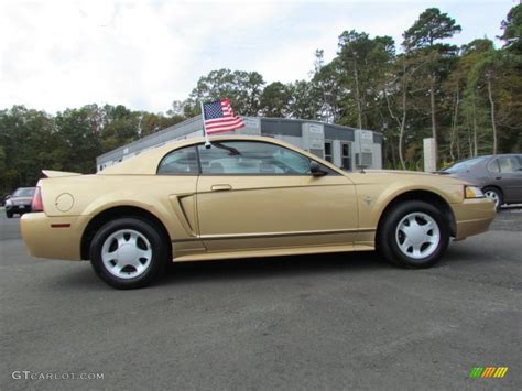 Sunburst Gold Metallic 2000 Ford Mustang V6 Coupe Exterior Photo