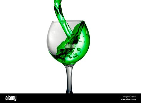 Green Water Pours Into A Glass On A White Background Stock Photo Alamy