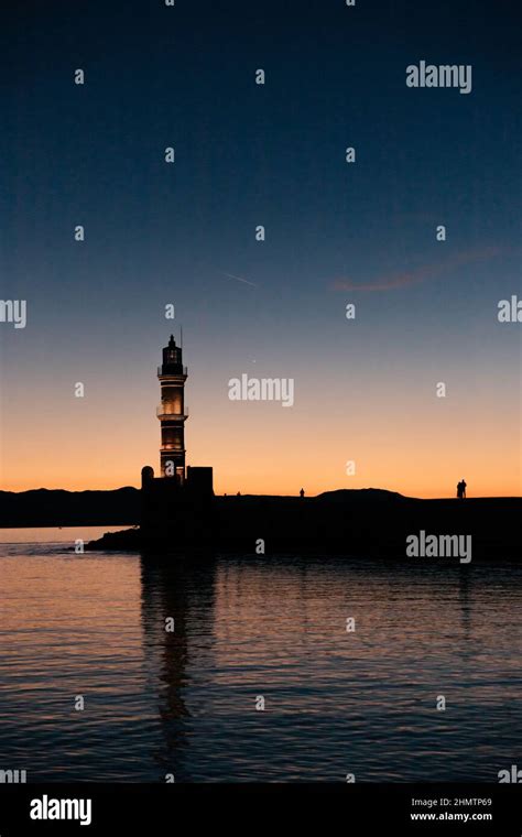 View Of Old Venetian Harbour Waterfront And Lighthouse In Sunset Time