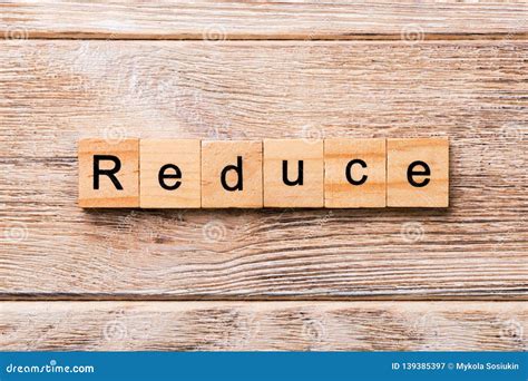 Reduce Word Written On Wood Block Reduce Text On Wooden Table For Your