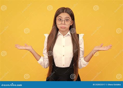 Confused Child In School Uniform And Glasses For Vision Protection