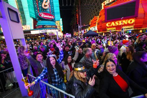 New Years Eve Revelers Dance By A Stage At The Fremont Street