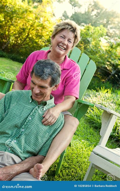 Mature Couple Relaxing Outdoors Stock Photo Image Of Friendship