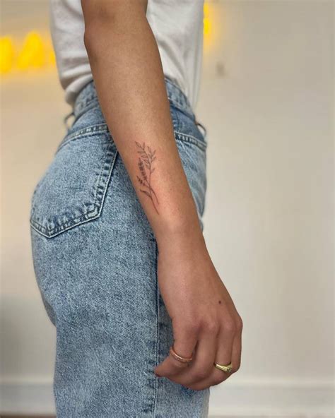 Fine Line Lavender Tattoo Located On The Wrist