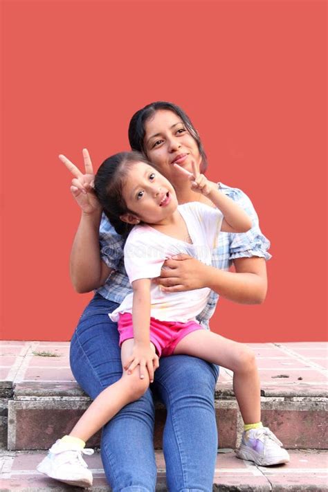 Latina Mom With Her Year Old Daughter With Attention Deficit Disorder Adhd Hug And Show Their