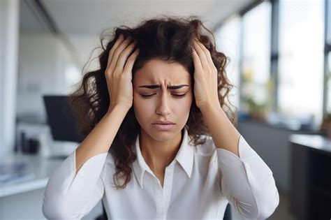 Premium Ai Image Woman Suffering From Stress Or Headache At Workplace