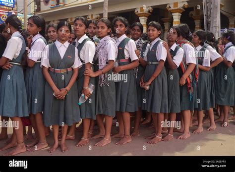 South Indian School Girls In Uniform Dress Orderly Queuing Up To Visit Balkrishna Temple In