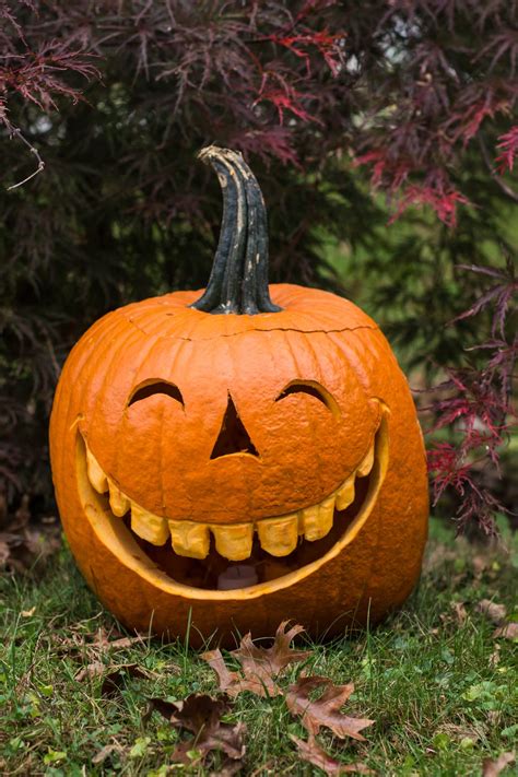 55 Best Pumpkin Face Ideas to Carve or Paint for Halloween