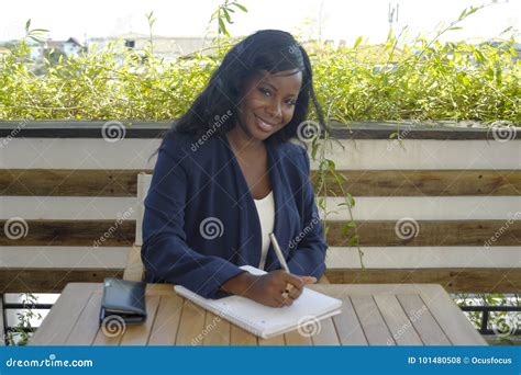 Young Attractive Black African American Woman Sitting Outdoors At