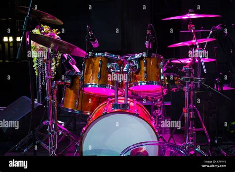 Drum Set On Stage And Magenta Light Background Empty Stage With