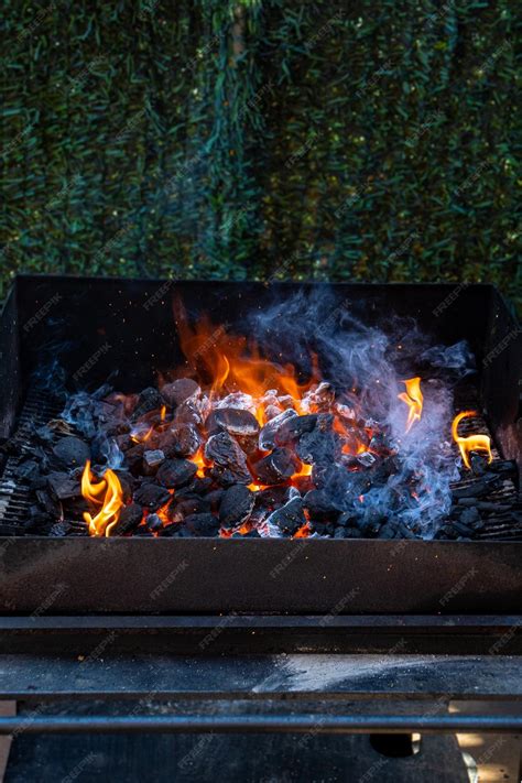 Premium Photo | Charcoal and embers burning at full capacity at its