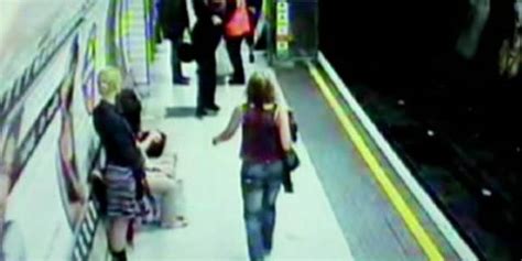 Caught On Tape Woman Survives After Being Violently Pushed Onto The Train Tracks In London