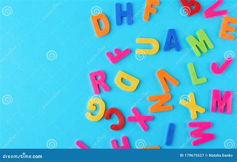 Plastic Multi Colored Letters Of The English Alphabet On A Bluet