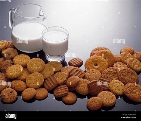 Milk and cookies variety arrangement on reflective background Stock ...