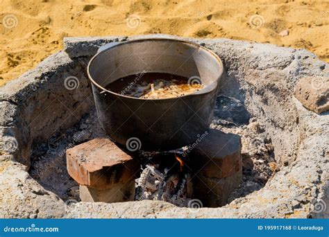 Cooking Pilaf In A Large Cauldron Over An Open Fire Close Up Stock