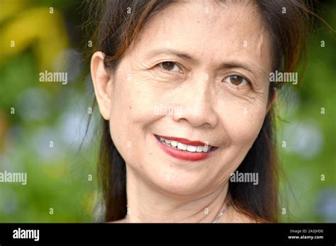 An Older Filipina Female Senior Smiling Stock Photo Alamy