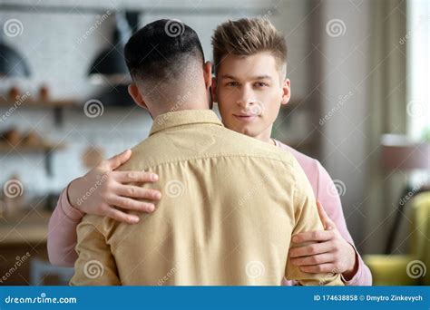 Two Young Men Hugging Each Other with Tendernessand Love Stock Photo ...