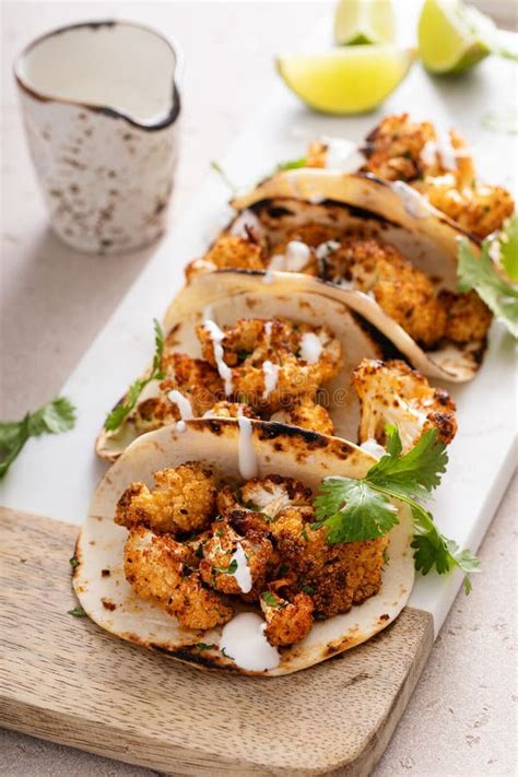 Spicy Cauliflower Tacos With Cilantro And Mexican Crema Stock Image