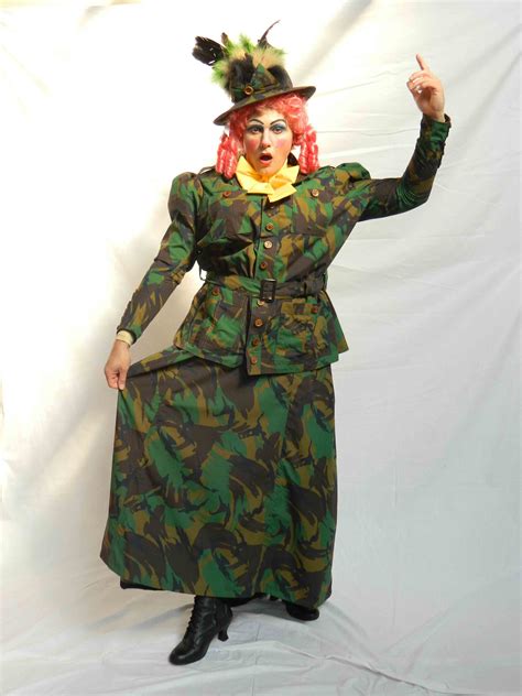 a woman dressed as a soldier with red hair and green camouflage print ...