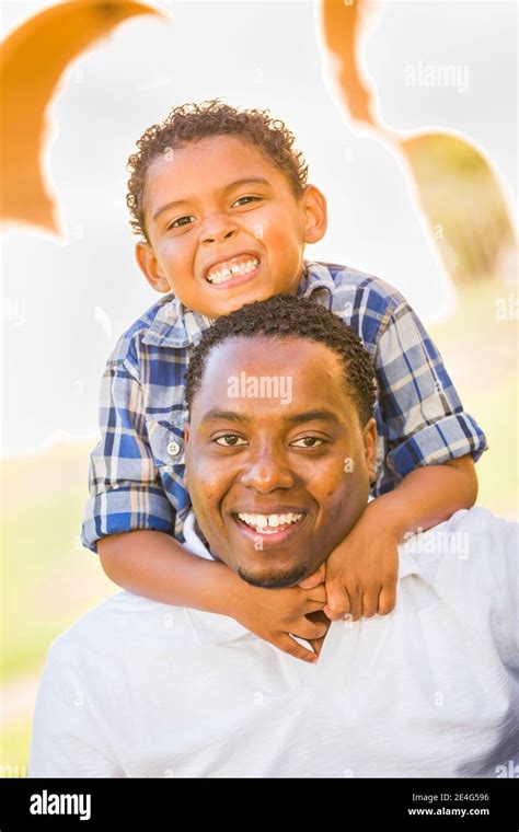 Happy African American Father And Mixed Race Son Playing At The Park