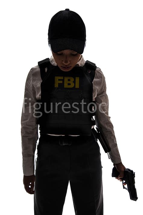 Figurestock A Tough Woman Fbi Agent In Silhouette Holding A Gun